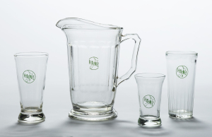 Glassware, mid-1960s, by Crown Crystal Glass, New Zealand (GH021024-25, GH023164, GH024221, Te Papa) Standardised glassware was introduced by the Hotel Association of New Zealand (HANZ) in 1963.  The 8 ounce glass on the far right was favoured by male drinkers.  The smaller 7 ounce glass on the left and the small sherry glass were favoured by women drinkers.  Jugs were considered an innovation in the early 1960s. 