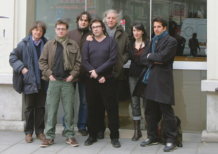 Members of the French satirical newspaper Charlie Hebdo, including cartoonists Cabu (L), Charb (2nd L), Tignous (4th L) and Honore (5th L), Julien Berjeaut aka Jul (R) and Catherine Meurisse (2nd D) posing in front of the headquarters of the weekly in Paris on March 15, 2006.  AFP PHOTO JOEL SAGET        (Photo credit should read JOEL SAGET/AFP/Getty Images)